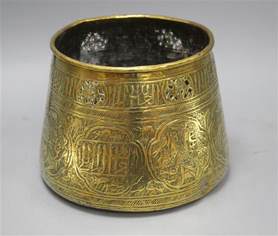 A Cairoware brass jardiniere, decorated with panels of figures and calligraphy, height 18cm, diameter 24cm